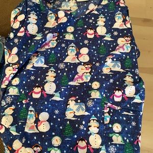 All Christmas themed. Medical scrubs. 10 tops 2 XL.